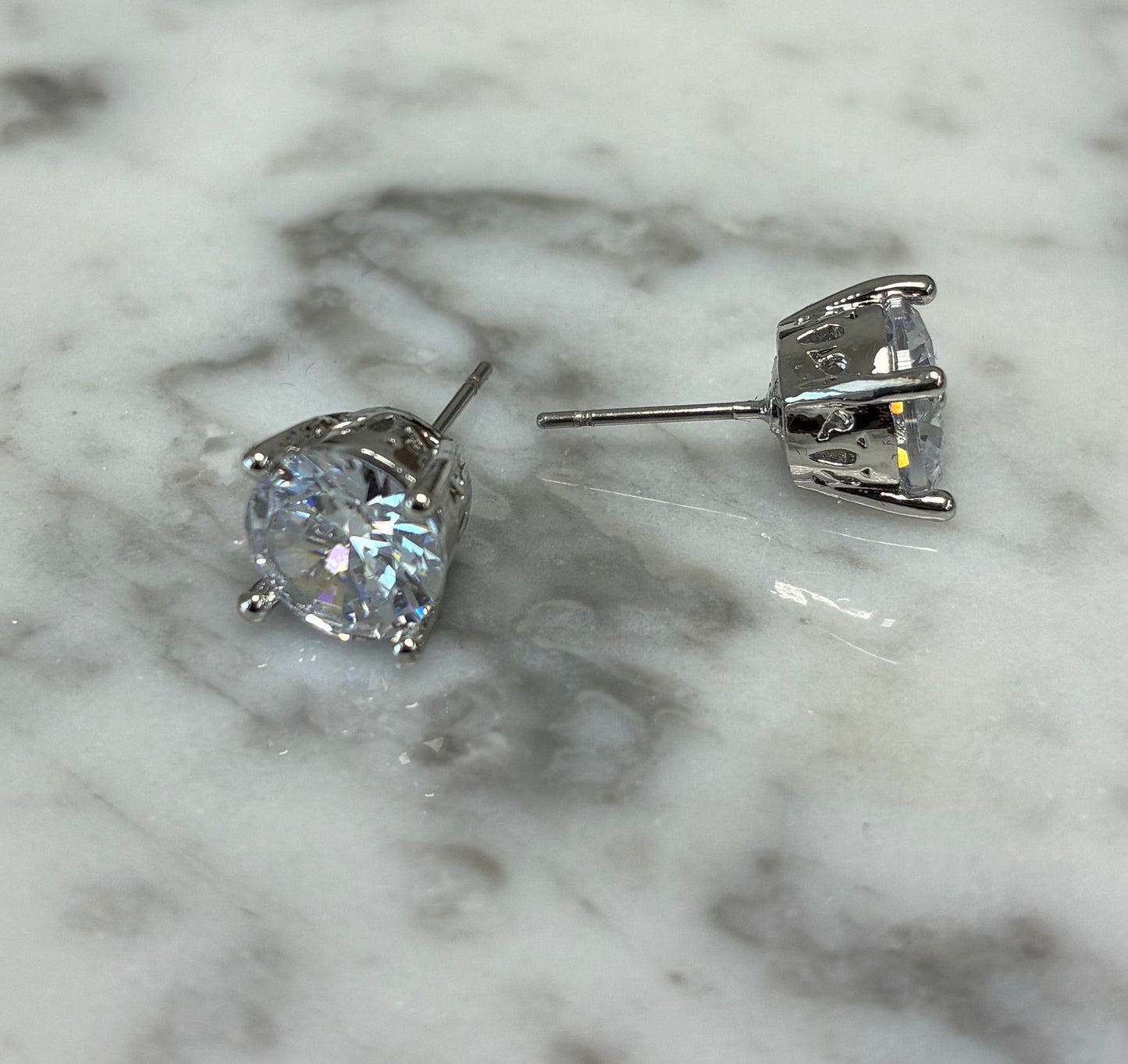 Lorena 8mm CZ stud earring featuring sparkling cubic zirconia set in a silver-toned metal.
