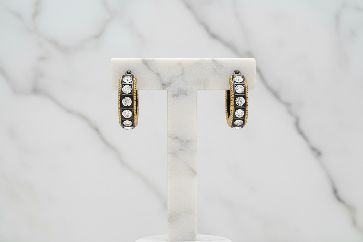 Lorena gold hoop earring with cubic zirconia stones, stylish jewelry accessory, visible with shiny finish and sparkling stones.