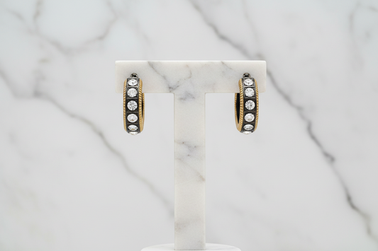 Lorena gold hoop earring with cubic zirconia stones, stylish jewelry accessory, visible with shiny finish and sparkling stones.