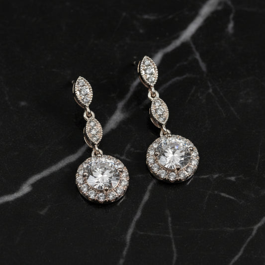 Lorena fancy silver dangle CZ earring with sparkling cubic zirconia stones and intricate design, perfect for elegant style.