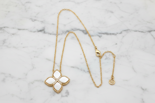 Lorena Gold MOP Clover Necklace featuring a delicate chain and a sparkling mother of pearl clover pendant.
