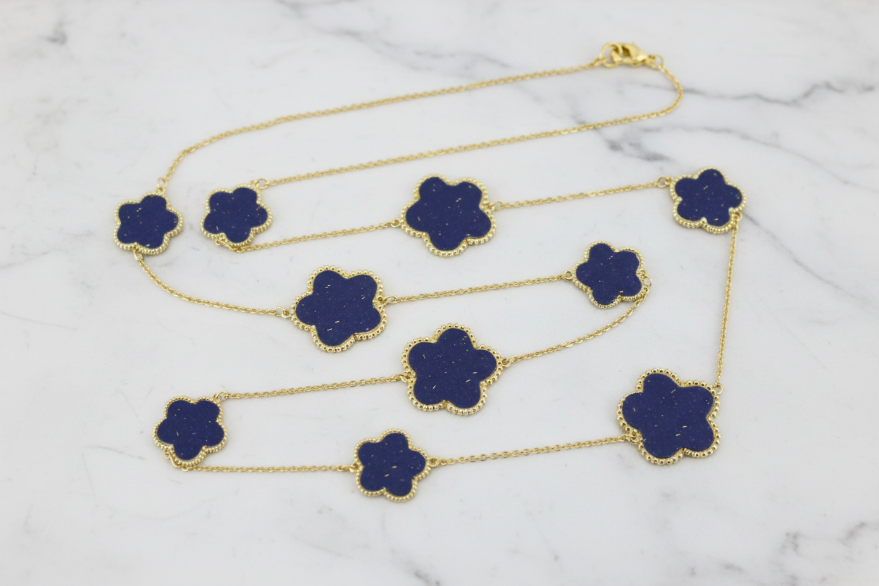 Lorena gold necklace with floral design, 36-inch length, elegant jewelry featuring intricate flower details.