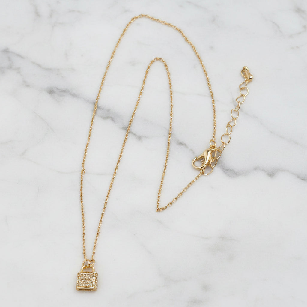 Lorena 16-inch gold necklace with pave lock pendant, featuring a sleek and elegant jewelry design.