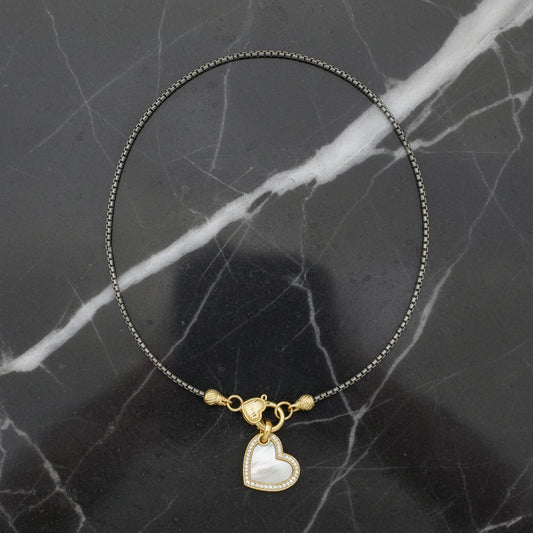 Lorena 17-inch two-tone necklace with a mother-of-pearl heart pendant, showcasing elegant jewelry design and craftsmanship.