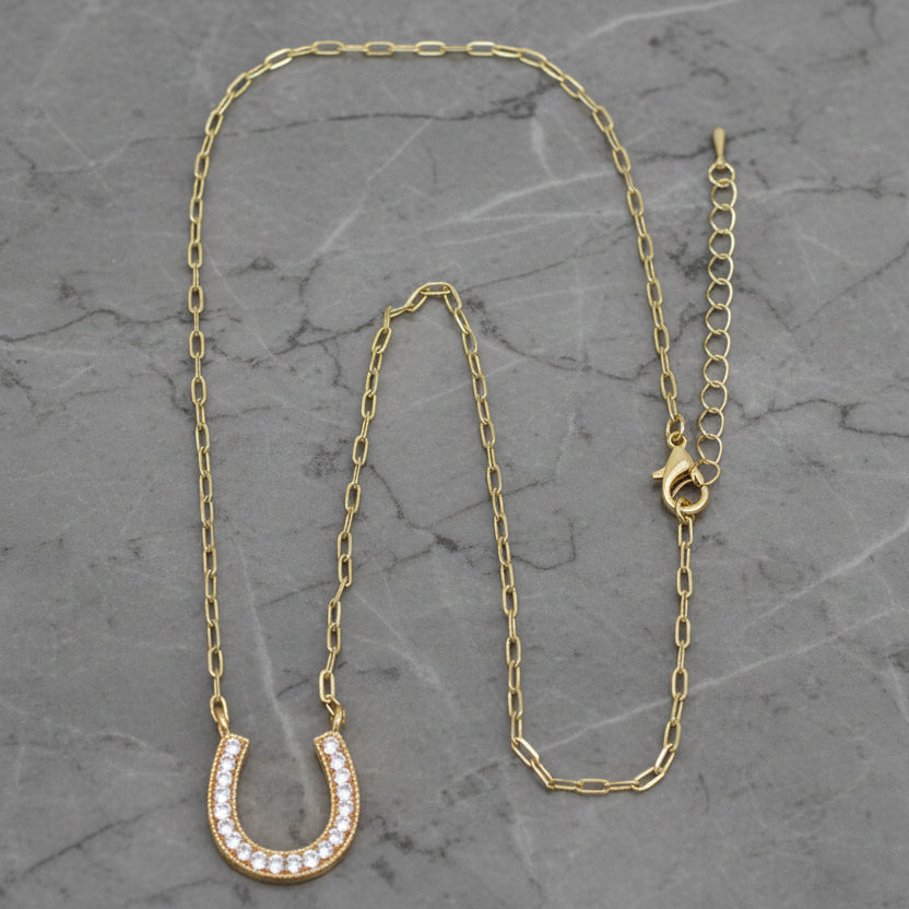 Lorena gold chain necklace with a horseshoe pendant, 16-inch length, featuring a stylish and elegant jewelry design.