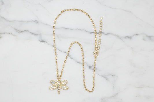 Lorena gold chain necklace featuring a pave dragonfly pendant, showcasing intricate detailing and elegant jewelry design.