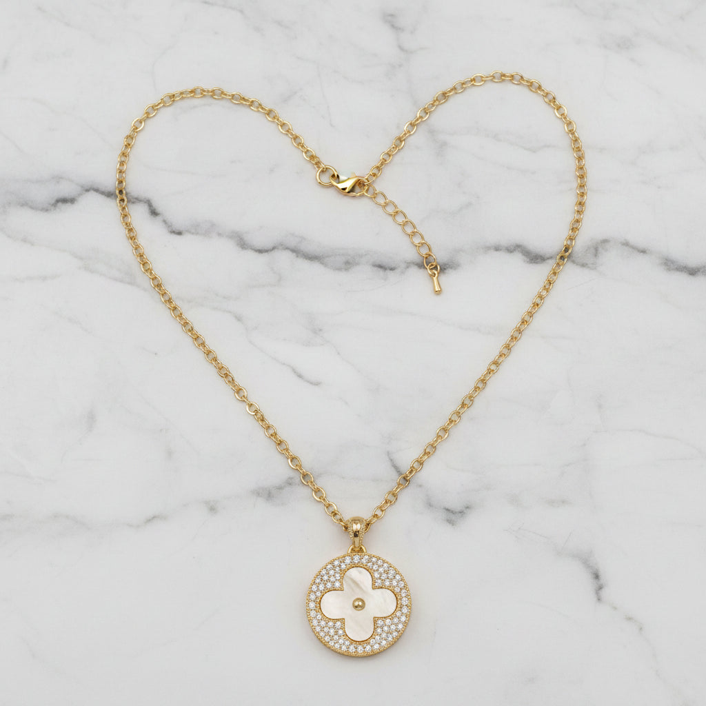 Lorena gold chain necklace with mop flow pendant, featuring a sleek chain and elegant pendant design.