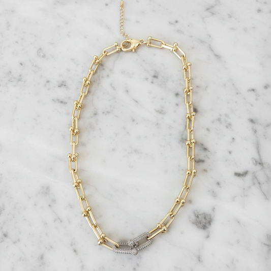 Lorena gold link necklace with pave decorative links, showcasing a stylish and elegant jewelry piece.