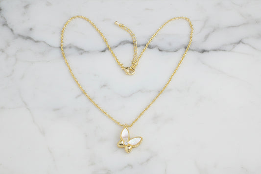 Gold and mother of pearl butterfly necklace by Lorena, 16-inch length, featuring a delicate butterfly pendant.