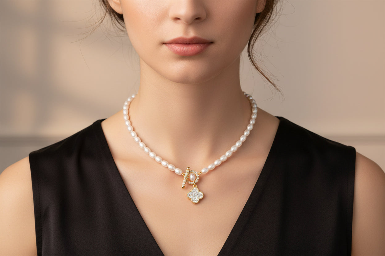 Lorena pearl necklace with pave toggle clasp and charm accents, elegant jewelry piece featuring lustrous pearls and intricate details.