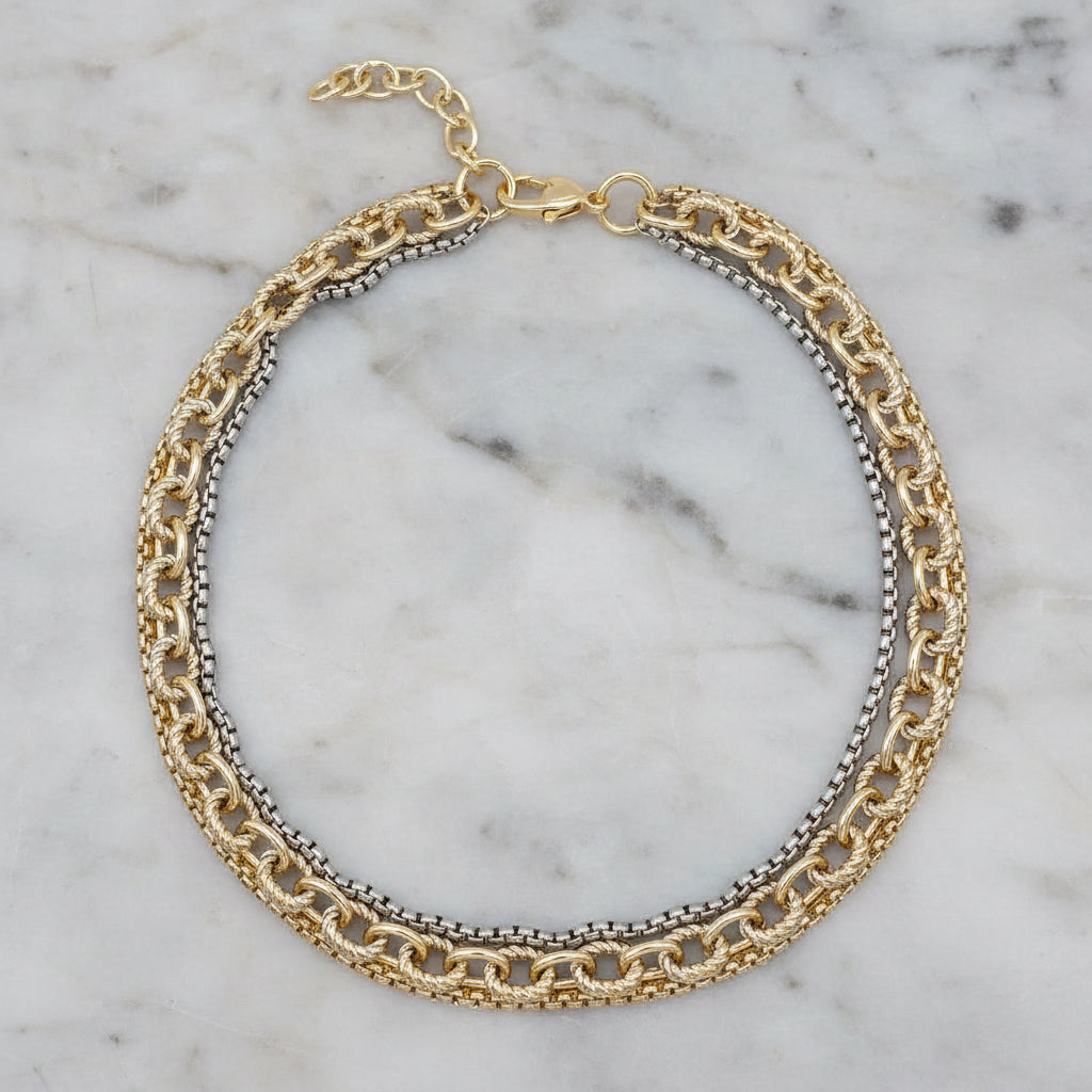 Lorena two-tone multi-chain necklace, 17-inch length, featuring layered chains in mixed metal tones, stylish and versatile jewelry piece.
