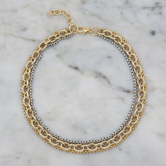 Lorena two-tone multi-chain necklace, 17-inch length, featuring layered chains in mixed metal tones, stylish and versatile jewelry piece.