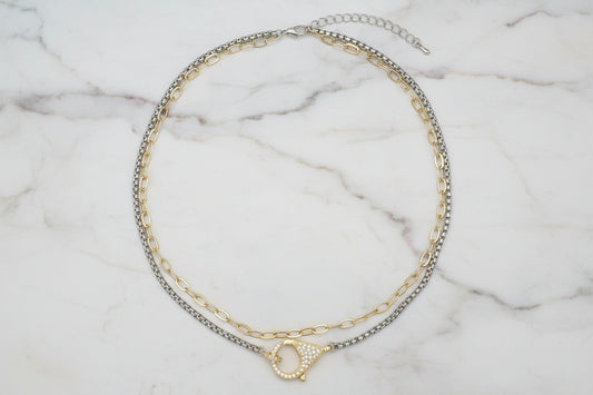 Lorena Two Tone Multi Chain Necklace with Pave Clasp, featuring layered chains in gold and silver tones.