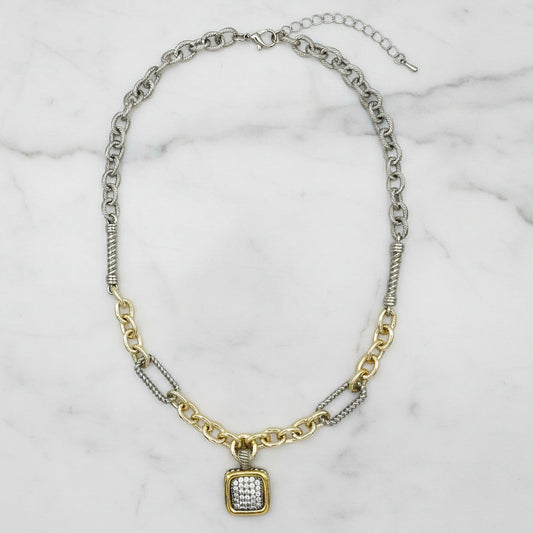 Lorena two-tone necklace with pave square pendant, featuring mixed metal design and sparkling detailing.