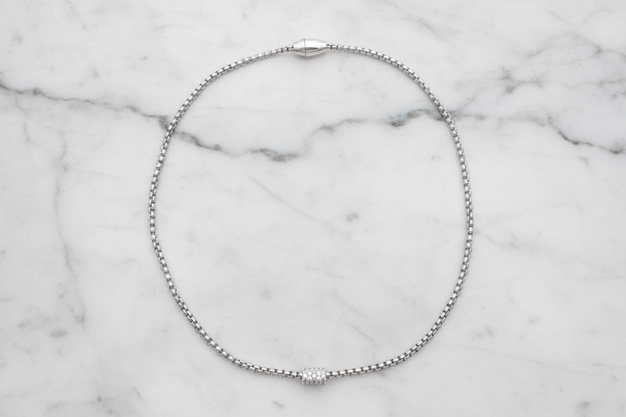 Lorena box chain necklace with pave barrel pendant, 17-inch length, showcasing a sleek gold-toned jewelry piece.