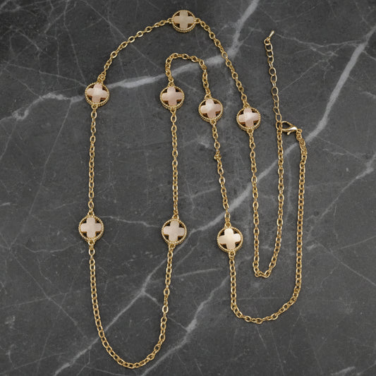Lorena 36-inch gold chain necklace with white mother-of-pearl clover pendants, showcasing elegant jewelry design.