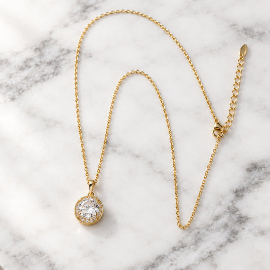 Dainty gold necklace by Lorena with a brilliant cubic zirconia pendant, elegant jewelry for everyday wear.