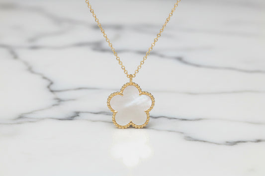 Gold flower necklace by Lorena, 16-inch chain featuring delicate flower pendant, stylish jewelry accessory.