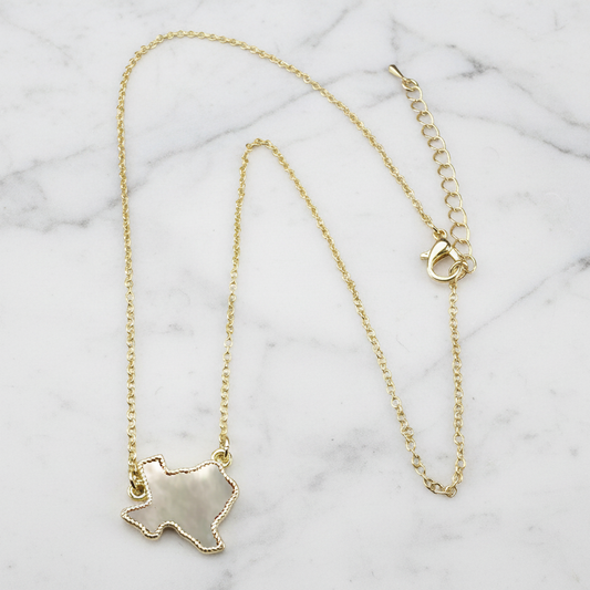Gold Texas necklace by Lorena, 16-inch chain with detailed Texas-shaped pendant, shiny and stylish jewelry accessory.