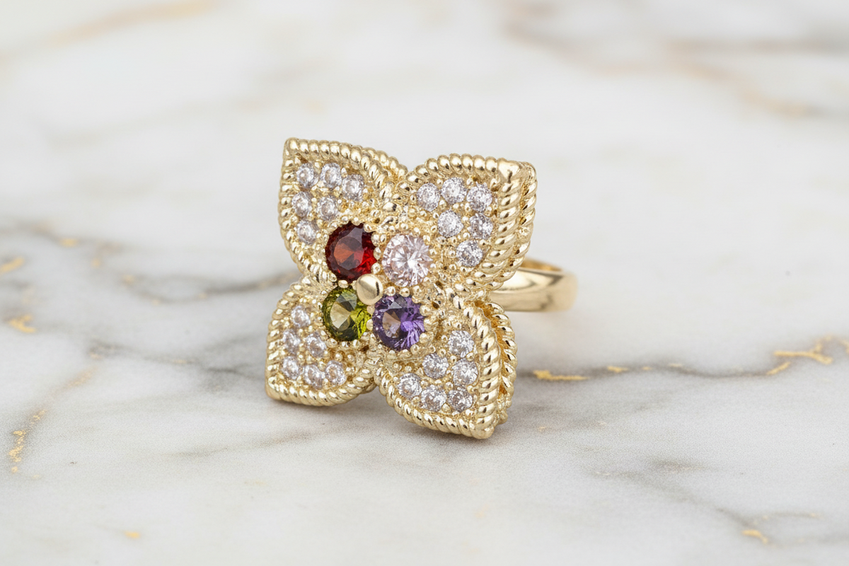 Gold pave multi-clover ring by MX featuring sparkling clover-shaped designs and a polished gold band.